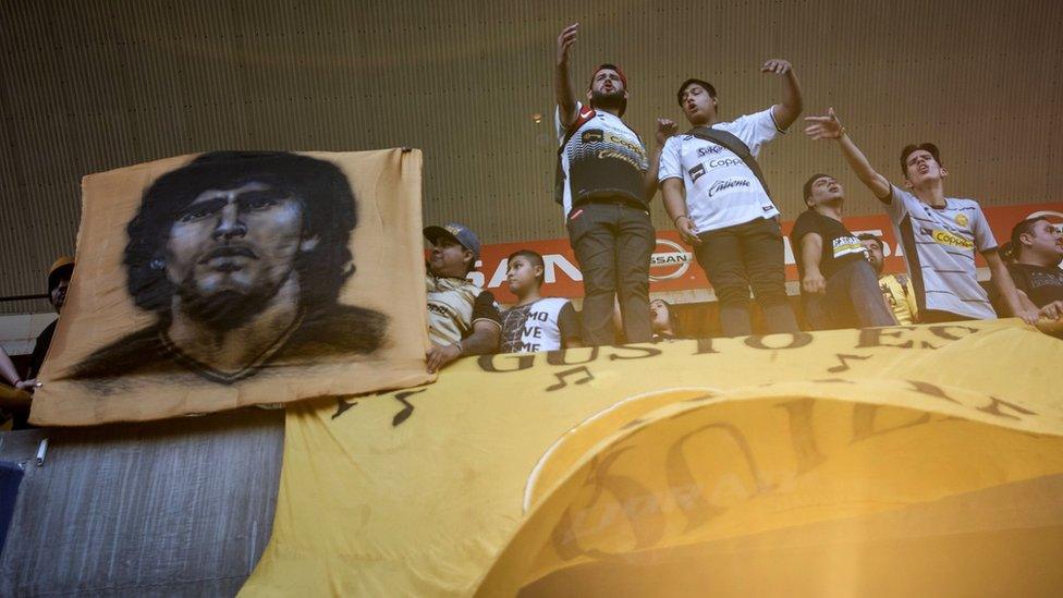 Fans cheer as they witness Diego Maradona's first training session as coach of Mexican football club Dorados on 10 September 2018