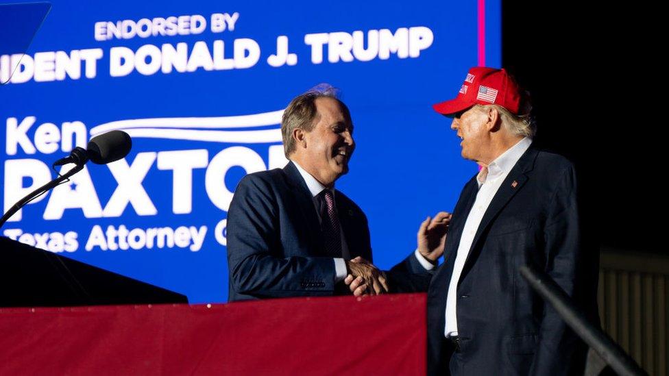 Ken Paxton with Donald Trump on stage