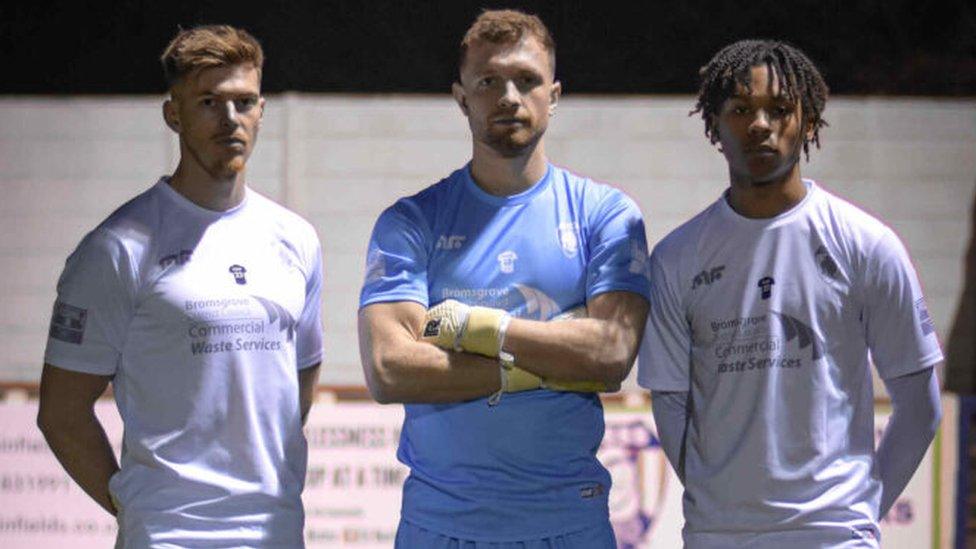 Players wearing the white kit