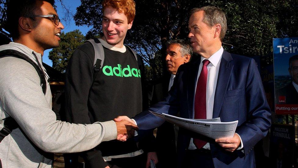 Opposition leader Bill Shorten shakes hands with a voter