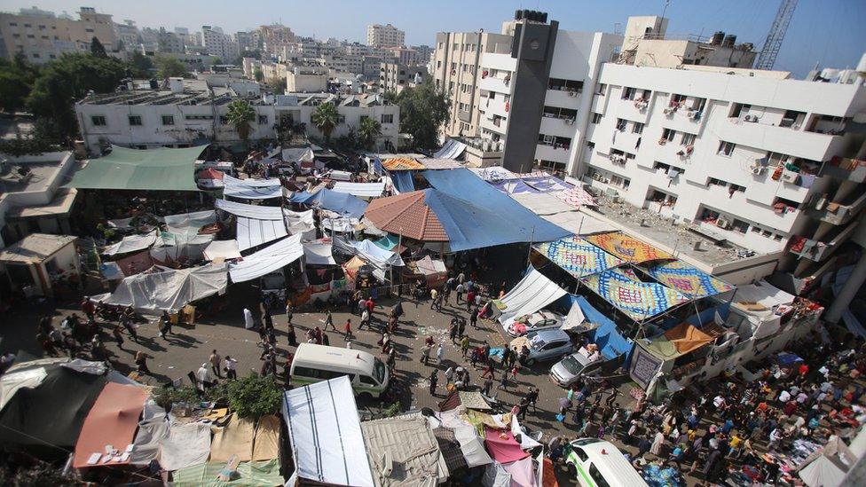 An aerial view of Al-Shifa Hospital in Gaza, with dozens of makeshift tents in the foreground