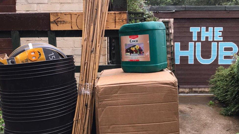 Canes, plant pots and boxes of equipment