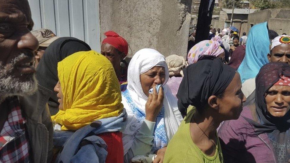 Grieving residents gather near the Koshe landfill in Addis Ababa. Photo: 12 March 2017