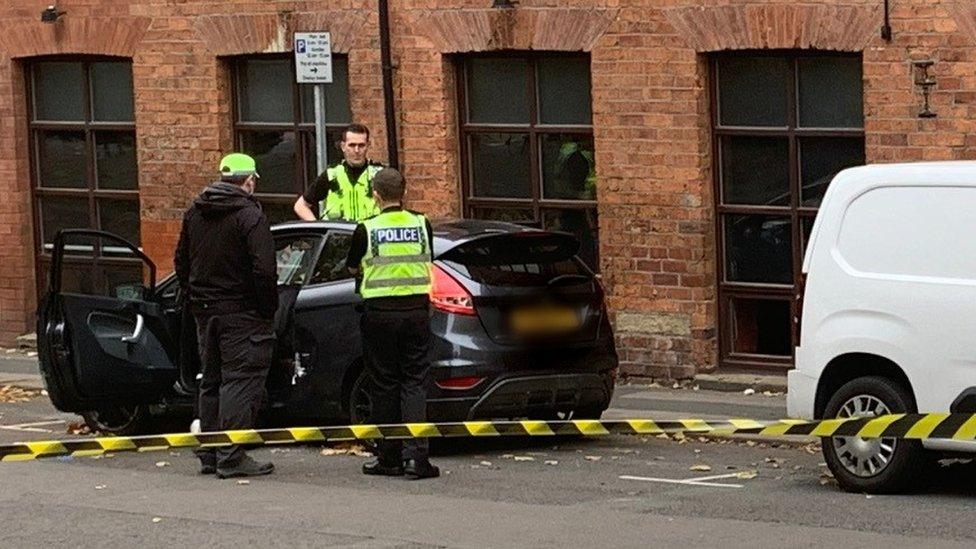 Police officers with car