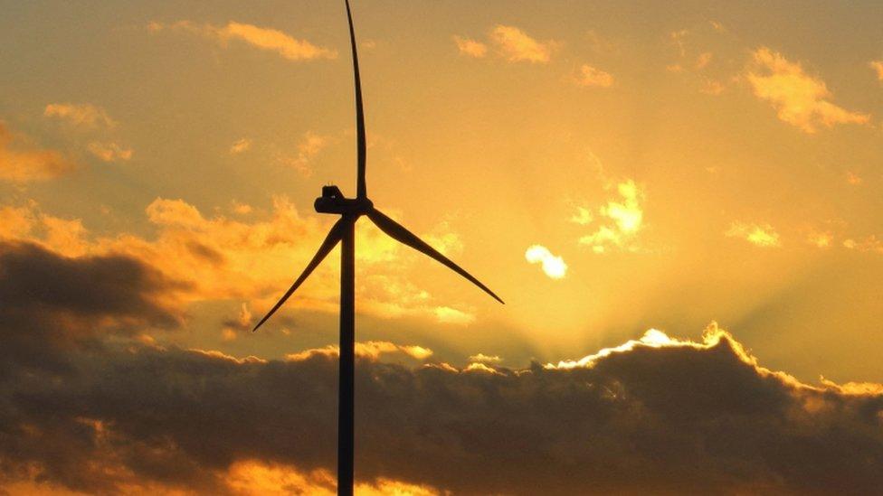 Wind turbine at sunset