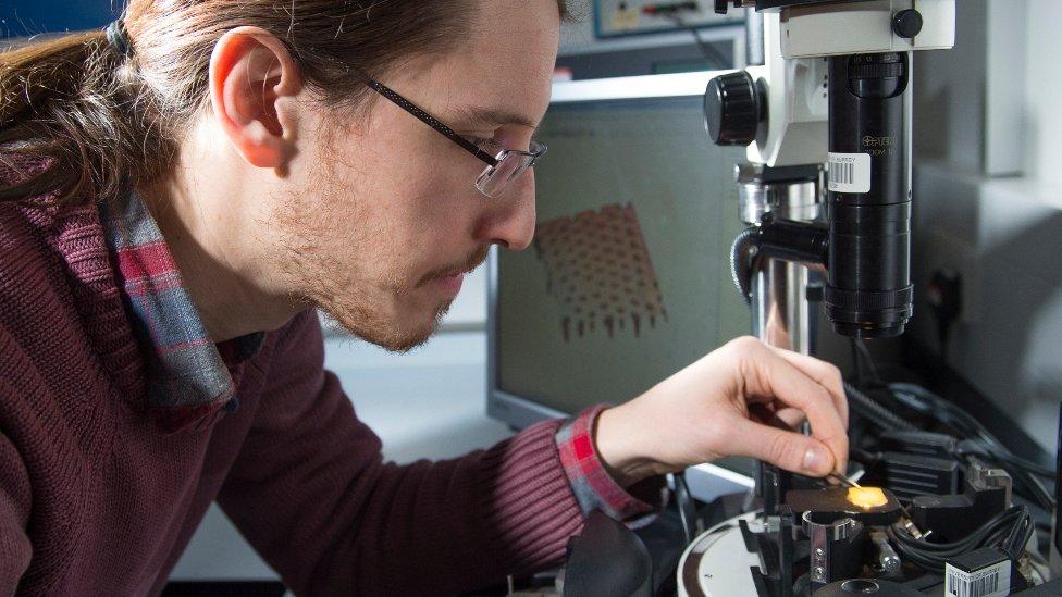 Co-researcher Nacho Martín-Fabiani preparing a paint sample for analysis with the atomic force microscope