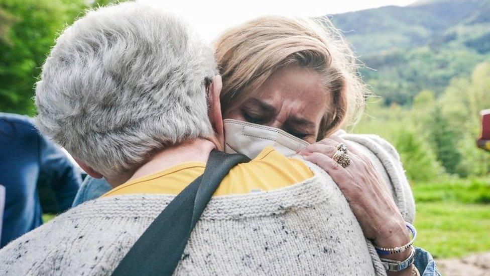 The Mayor of Stresa Marcella Severino (R) reacts in the area where a cable car crashed in Mottarone Stresa, near Turin