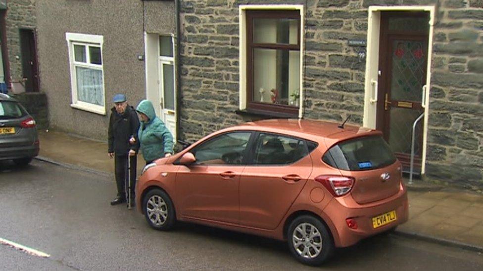 Couple's car outside their home