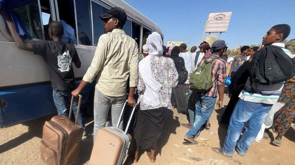 People gather at the station to flee from Khartoum during clashes between the paramilitary Rapid Support Forces and the army in Khartoum, Sudan April 19, 2023.