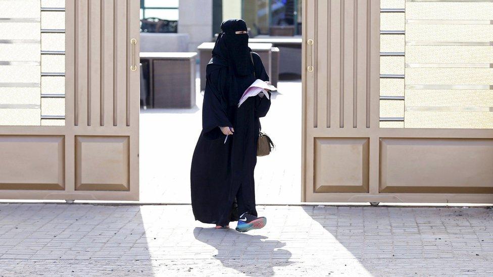 Woman leaves a polling station after casting her ballot