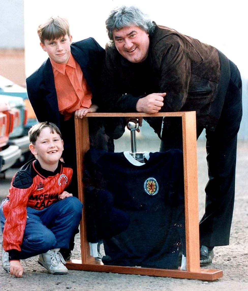 Andrew Dickson and David Wishart with the shirt their dads bought in 1991