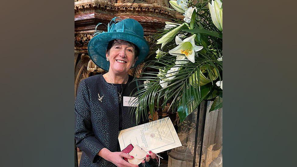 Jean Duerden at Worcester Cathedral with her Maundy money