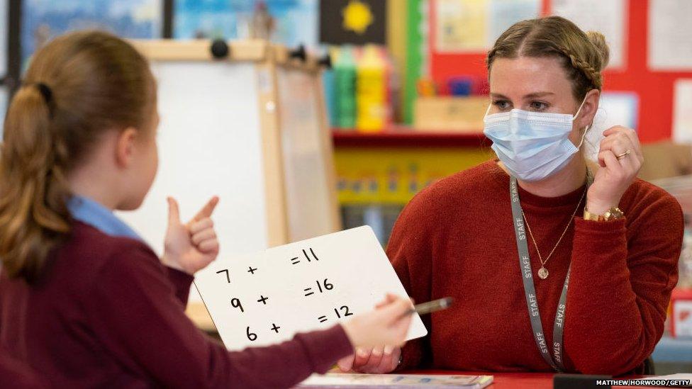 Teacher and student with masks