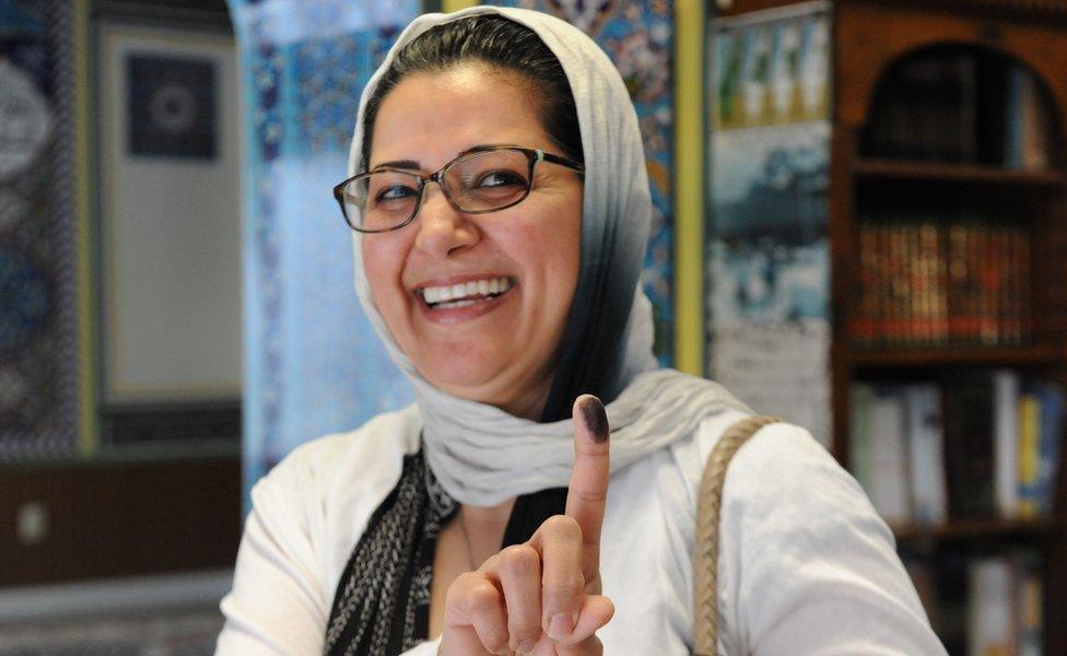 A woman residing in the US shows ink on her finger after casting her vote for the Iran Presidential election on May 19, 2017 at a polling station at Manassas Mosque in Manassas, Virginia