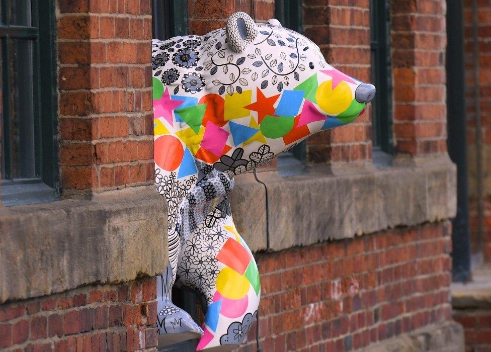 Decorated bear sculpture