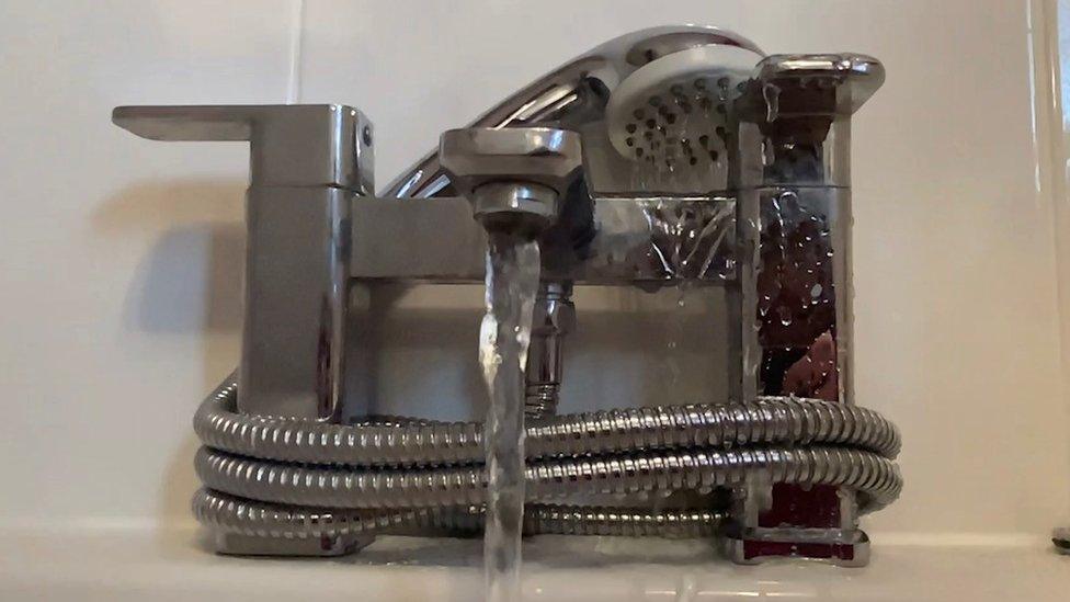 A mixer tap with water flowing