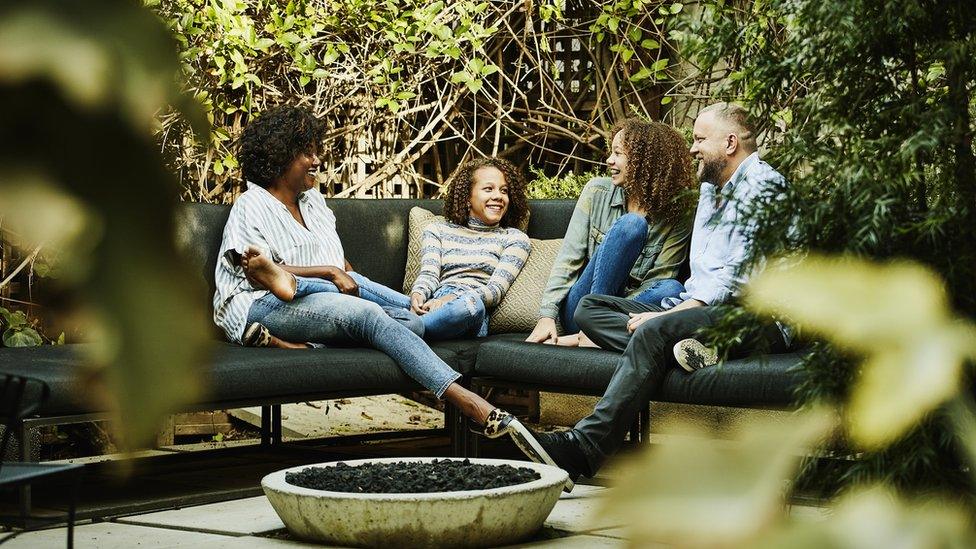 Friends seated outdoors