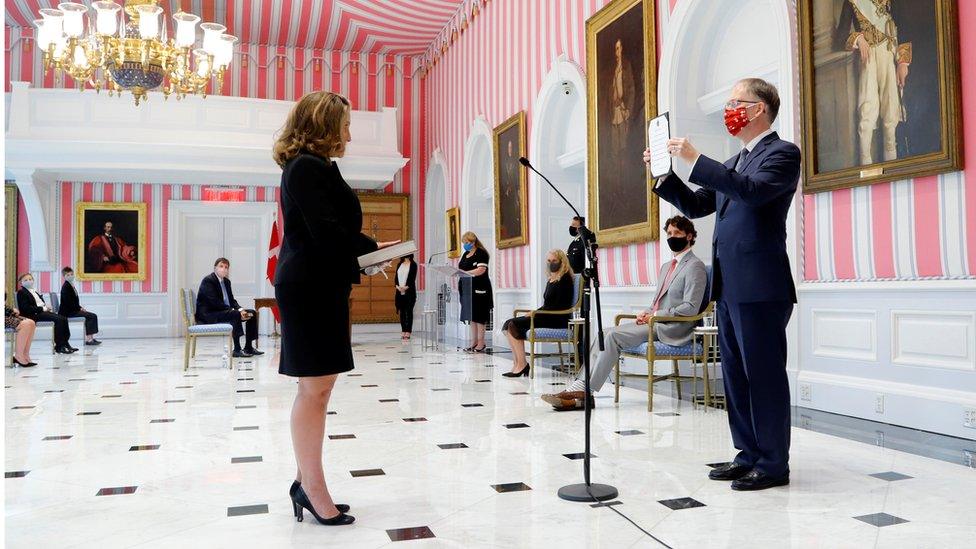 Chrystia Freeland is sworn-in as finance minister at Rideau Hall as Justin Trudeau looks on