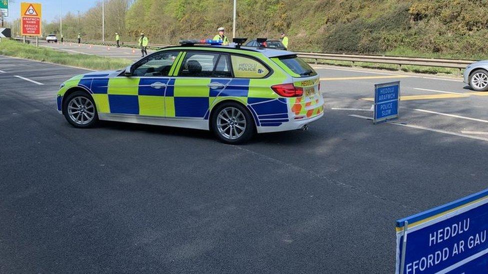 A police car at a check point on the A40