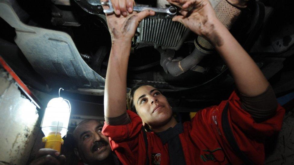 Young Moroccan mechanic, Oumaima Boukerch (R), works in a garage in Rabat, Morocco, 07 March 2016. Boukerch, 23, says she had chosen a profession reserved for men in the Moroccan society, which remains intolerant toward women. International Women"s day is celebrated on 08 March
