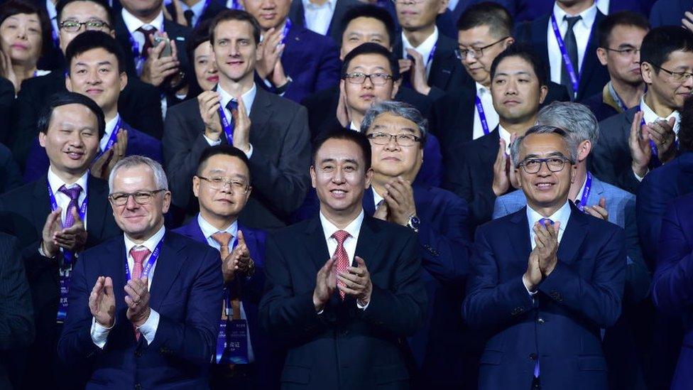 Evergrande Group Chairman Xu Jiayin (C) attends Evergrande New Energy Auto Global Strategic Partners Summit on November 12, 2019 in Guangzhou, Guangdong Province of China.