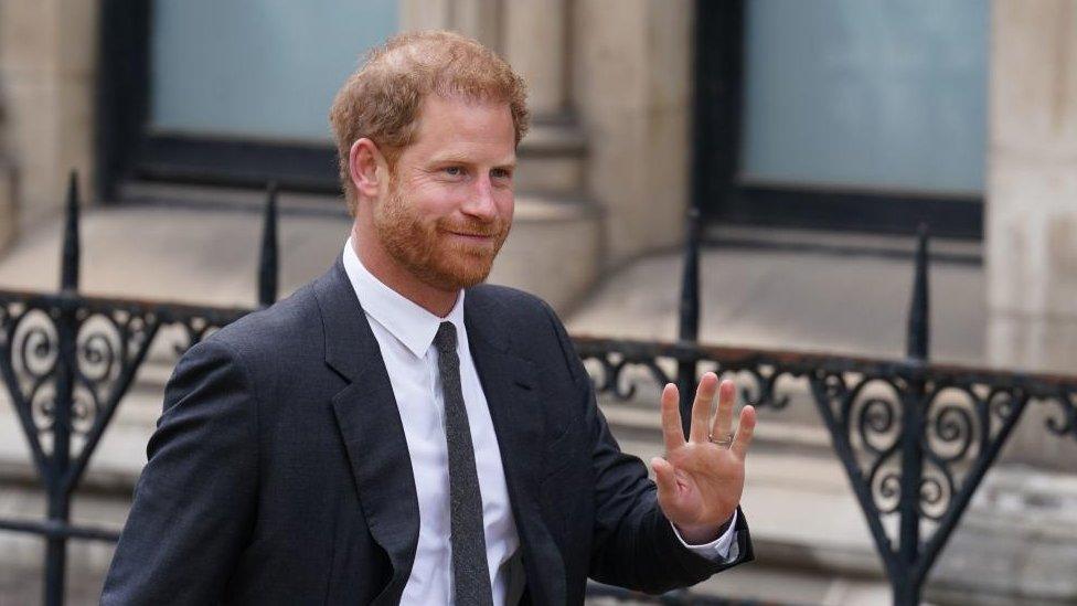 The Duke of Sussex waves as he arrives at the Royal Courts Of Justice