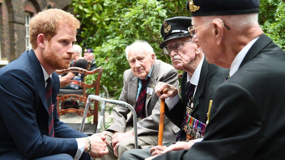 Prince Harry meeting a veteran at the premiere