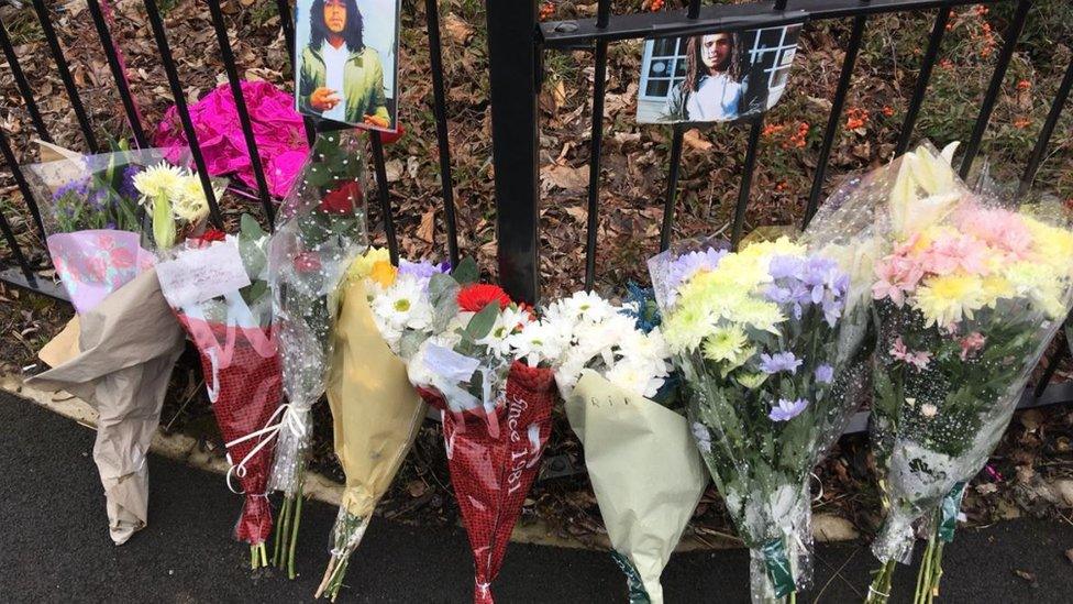 Flowers near the spot Jarvin Blake was killed