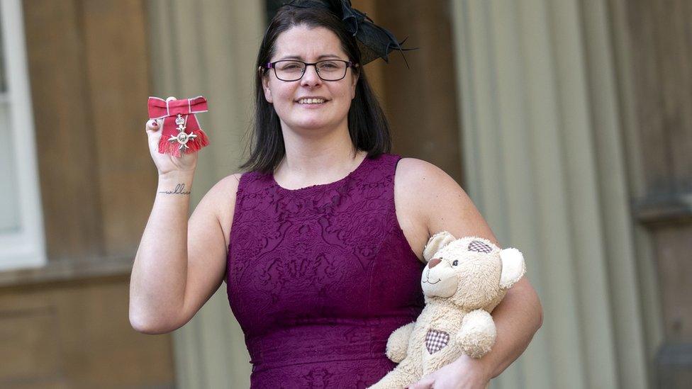 Melissa Mead with medal and teddy