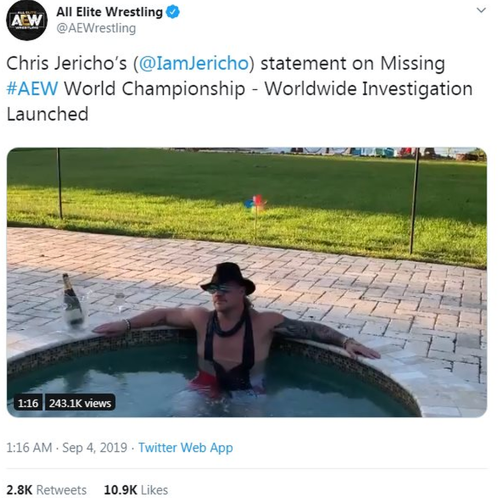 A screenshot of a tweet from AEW reading "Chris Jericho's statement on Missing AEW World Championship - Worldwide Investigation Launched", and sees Jericho sat in a hot tub drinking champagne