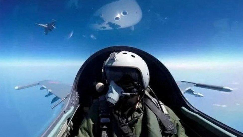 A pilot operating a Chinese aircraft at an undisclosed location