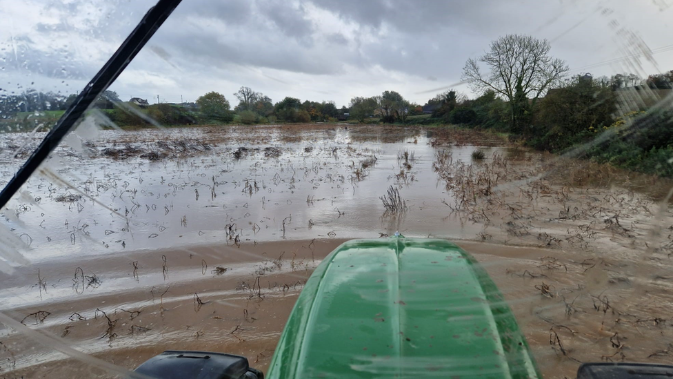 View of a flooded field from a tractor