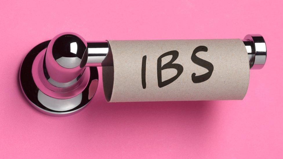 Empty toilet roll with letters IBS written on it