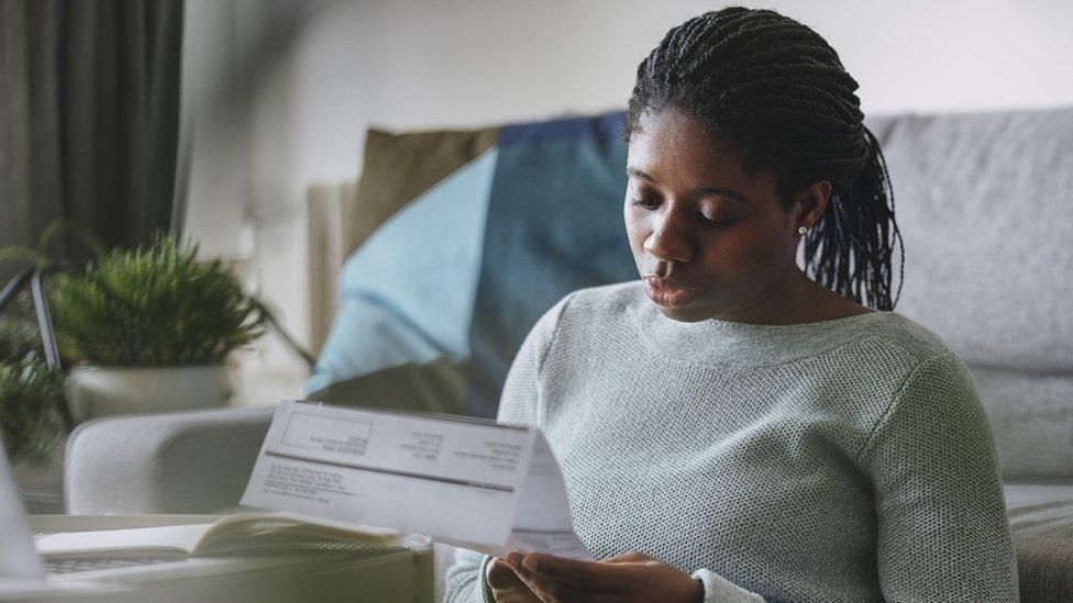 Woman examining bill