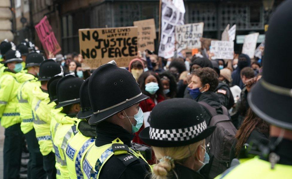 Police forming a barrier between BLM protesters and the counter demonstration