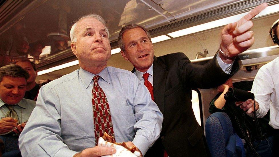 John McCain and George W Bush speak with reporter on Mr Bush's campaign train while in California