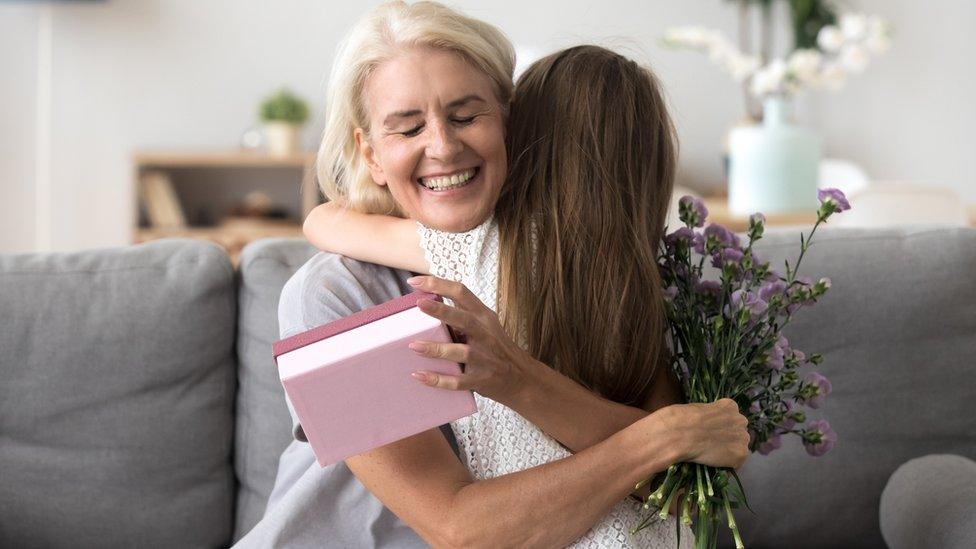 Grandmother hugging girl (file image)