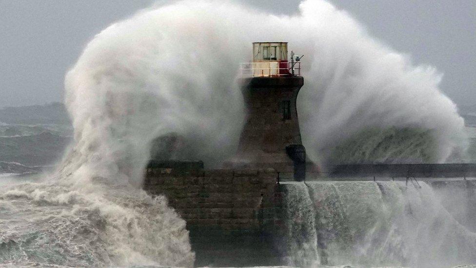 Waves crash against South Shields lighthouse