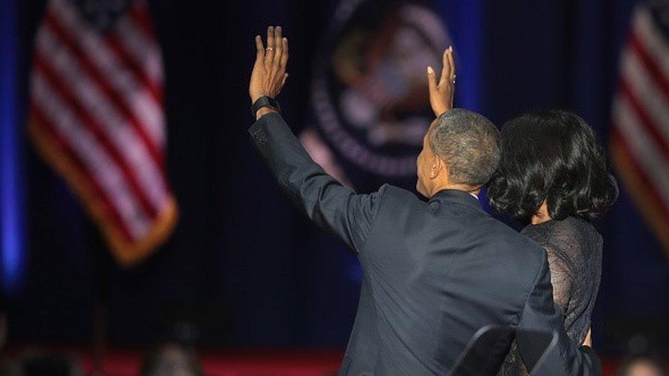 Barack and Michelle Obama waving