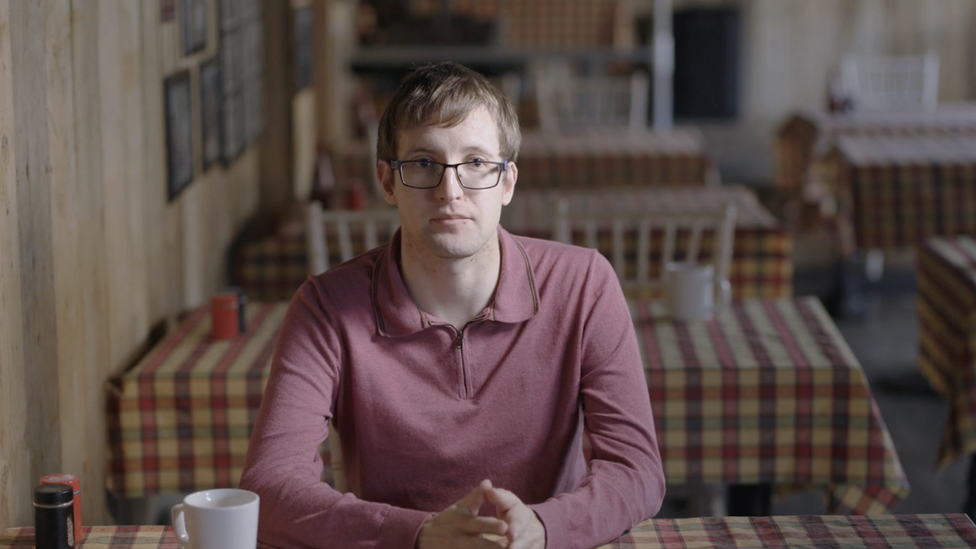 Portrait of Anthony Church in a cafe