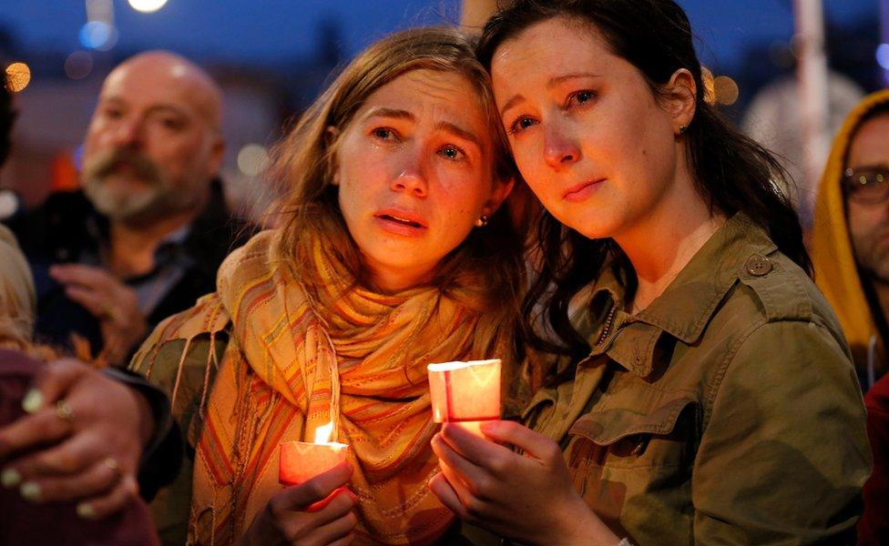 A couple joins residents of San Francisco and the Bay Area to mourn, honor, and remember the victims of a mass shooting at a LGBT nightclub in Orlando, Florida