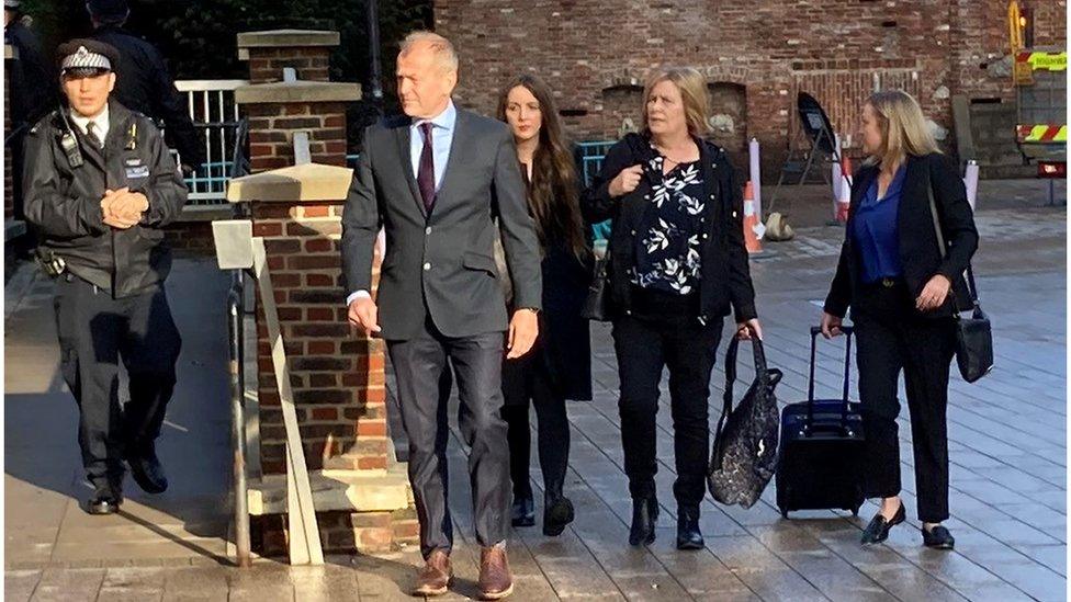 Sarah Sak (second right), the mother of Anthony Walgate, arriving at Barking Town Hall to attend the inquests