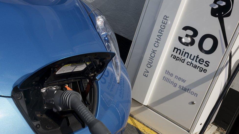 Nissan leaf being recharged at a rapid charging station