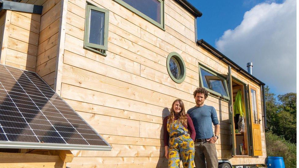 Tom Morgan and Amie Simons outside their home