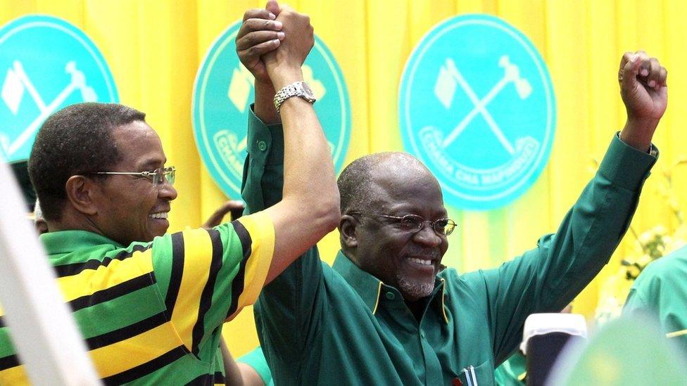 Tanzania President Jakaya Kikwete (L) congratulates politician John Magufuli in Dodoma on July 12, 2015,