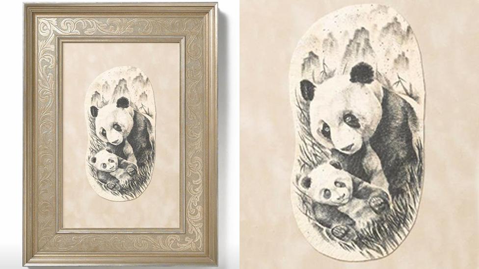 A framed preserved tattoo depicting two pandas