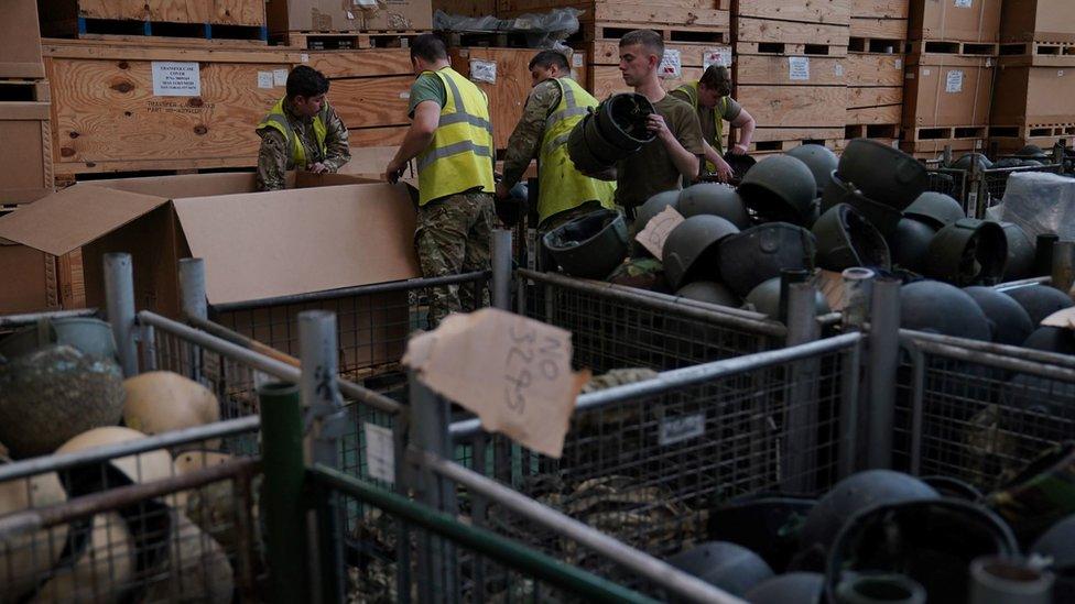 Surplus helmets being sorted