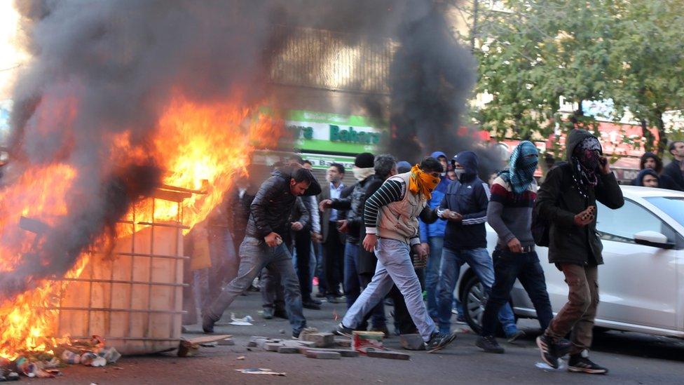 Kurdish protestors clash with Turkish police as they protest against the Turkish government in Diyarbakir,