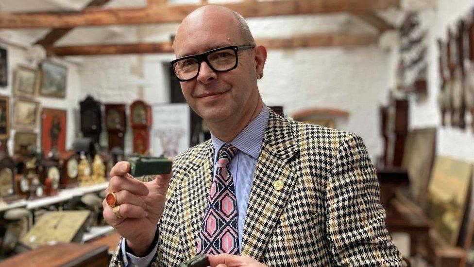 Marc Allum holding some lizard coffins