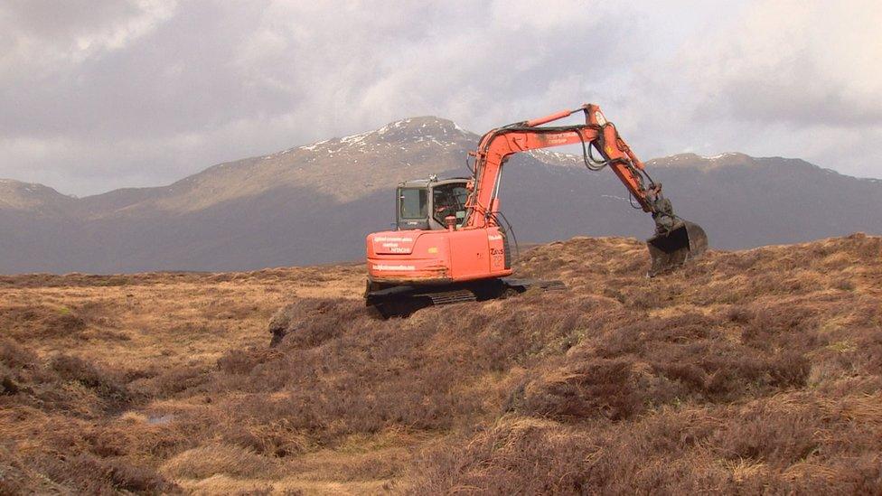 Digger on peat bog